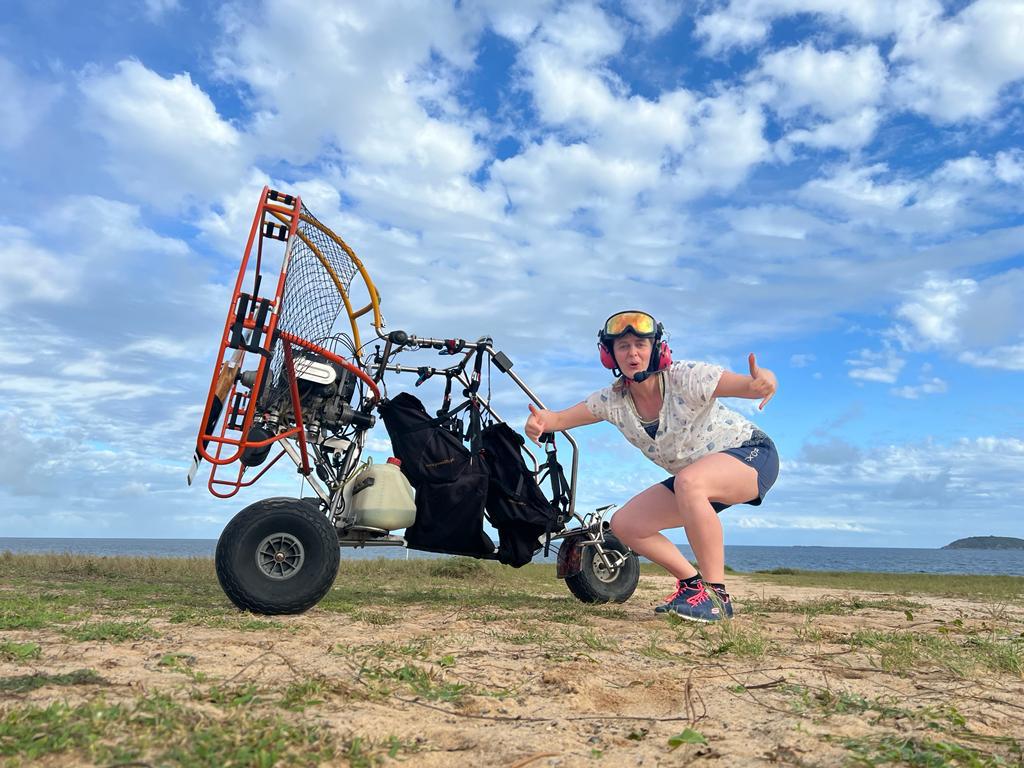 Student with paratrike on the beach
